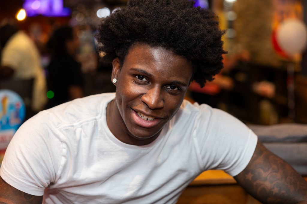 Kadary Richmond talks to the media during a Name, Image & Likeness event with Red Storm fans at the Applebee’s in Queens.